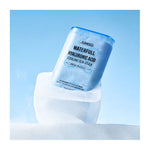 A blue Waterfull Hyaluronic Cooling Sunstick sits atop a clear ice cube, set against a light blue background.