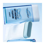 A close-up of the Waterfull Hyaluronic Cooling Sunstick, a hydrating sunscreen for sensitive skin, with its blue and white stick and lid shown against a light blue background.